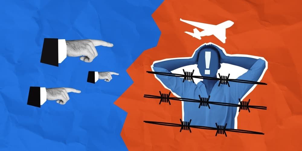Conceptual collage showing a migrant behind barbed wire with an airplane overhead, while hands in suits point in accusation. Blue and red background