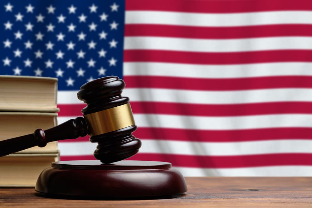 Judge's gavel on the background of the USA flag