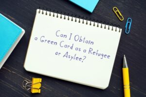 Can I Obtain a Green Card as a Refugee or Asylee? sign on the page.